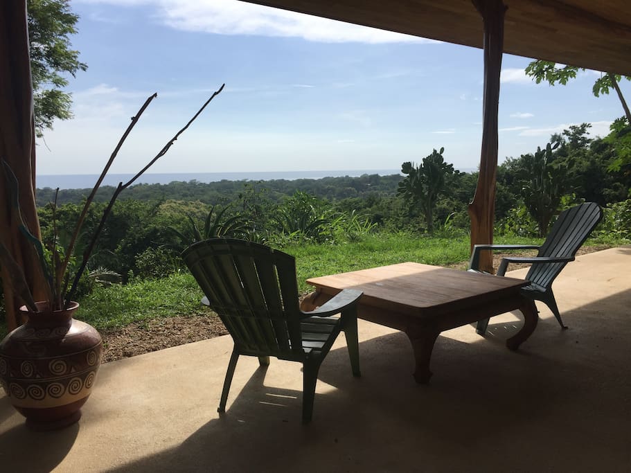 Dinning and sitting area over looking jungle and ocean