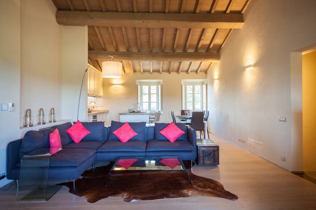 Main living room with kitchen and dining areas beyond