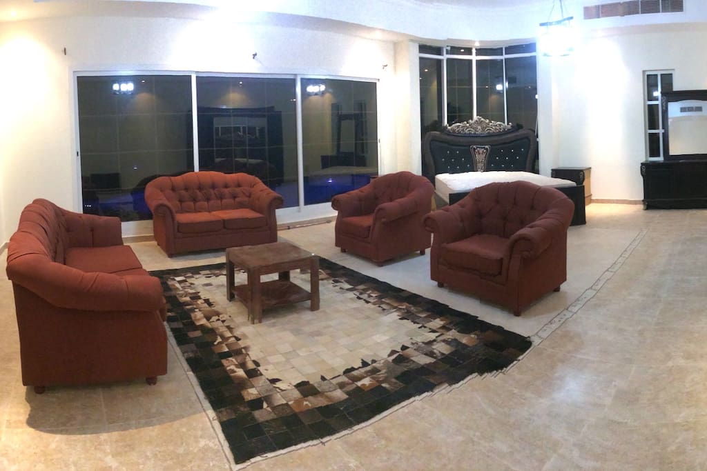 Massive Master Room with double bed, seating area, wardrobe. Glass sliding doors directly out to the pool. Private bathroom.