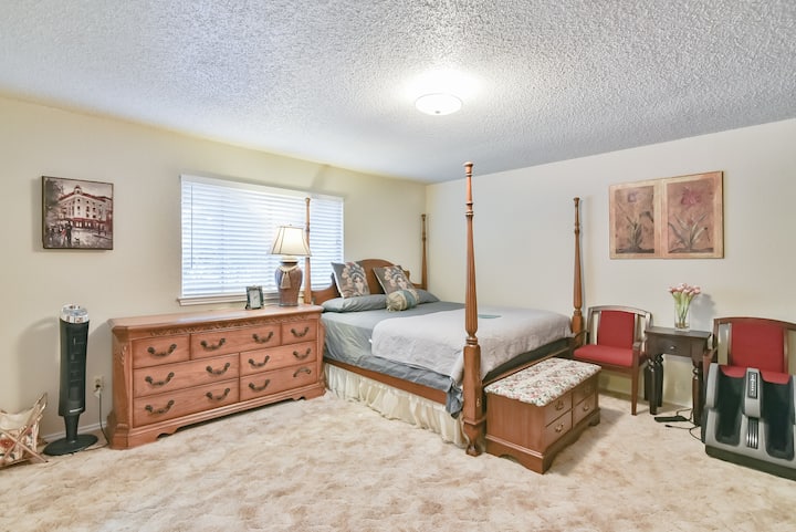 Oversized bedroom with kingset furniture/massager/work station