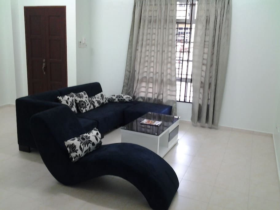 Living Room with Sofa, TV & Air Conditioner