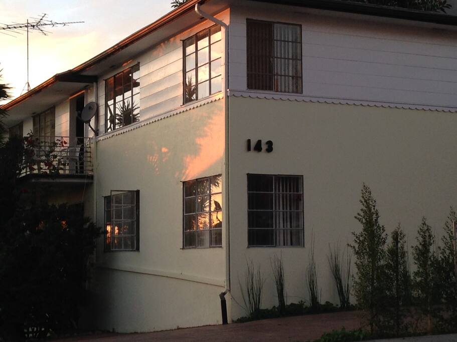 The apartment is the one upstairs and shares no walls with any other apartment.
