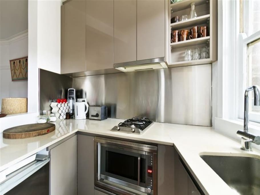 Modern kitchen, equipped with everything required to make meals.