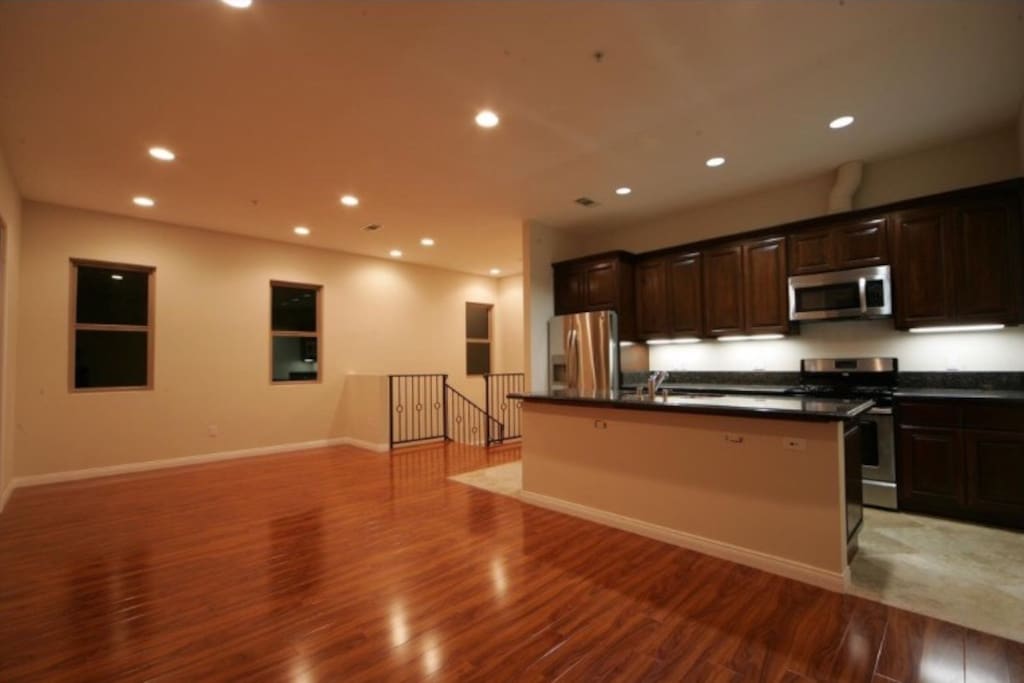 Come up to the open living space with the fully loaded kitchen.