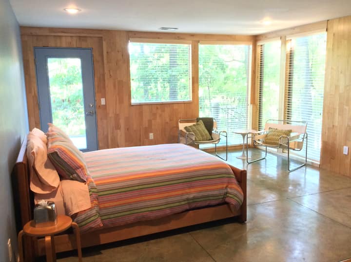One of two bedrooms on lower level. Opens to porch with outdoor seating.