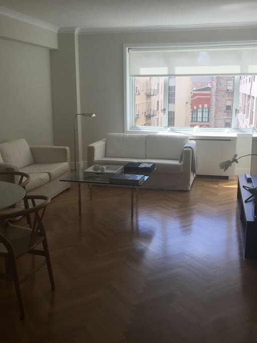 Beautiful, sun filled Living Room with herring bone floors