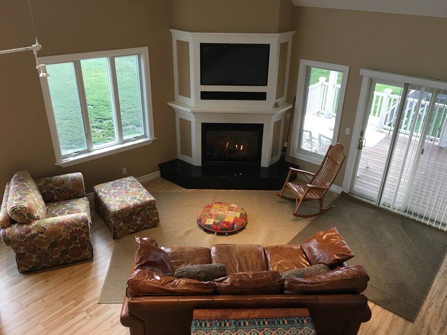 Living end of the greatroom. Seating for 8+. Leather 7foot couch, gas fireplace, Netflix and bluetooth audio.