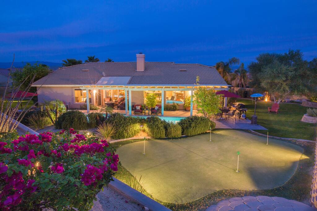 Putting green adjacent the pool and spa. Very spacious, private yard.