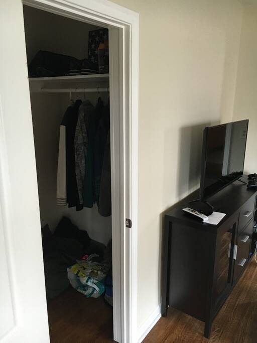This is the closet in the living room which you are free to use. There's a drawer and a place to hang clothes.
