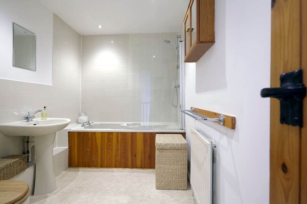 The bathroom, next door to your bedroom.