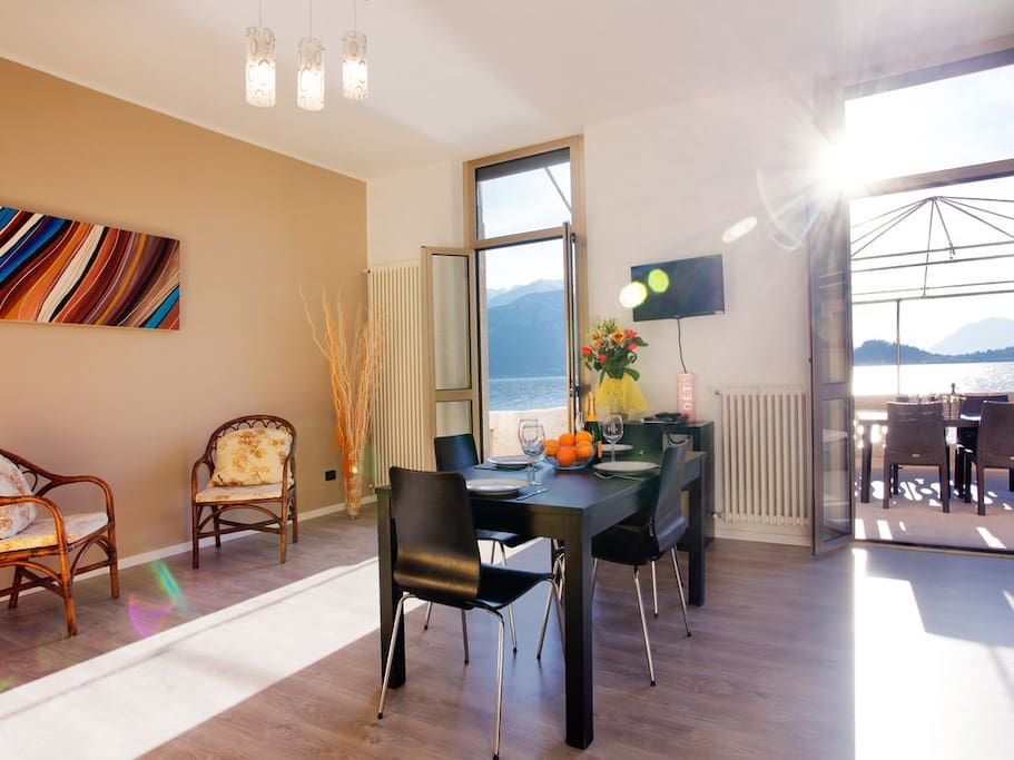 Kitchen diner leading to private lake view balcony