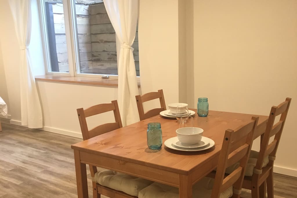 Use the dining room table for meals at home or desk work with nice natural light