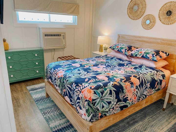 Bedroom one with a queen bed. 