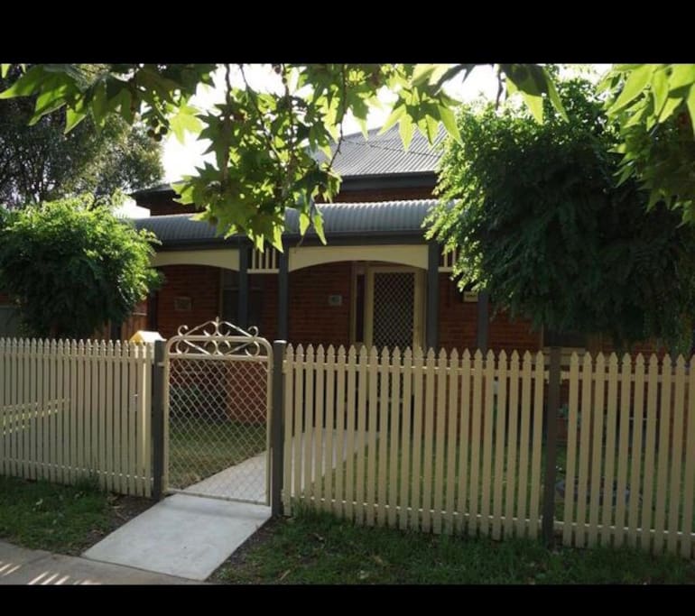 The classic picket fence, leafy mop top trees and a classic bullnose verandah greets you.