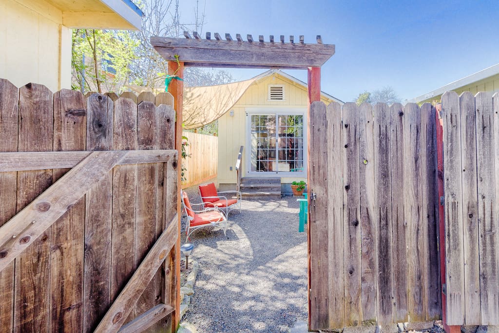 Enter through this gated fence and access the cottage door just a couple steps away