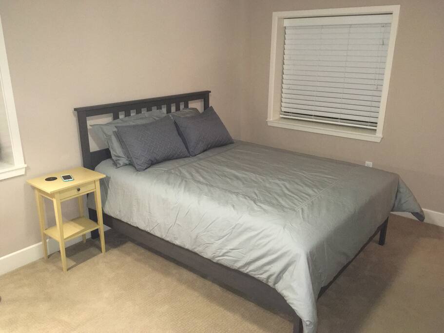 Large master bedroom with 2 charging tables!