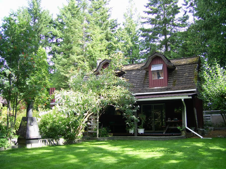 Green space & covered deck and BBQ area