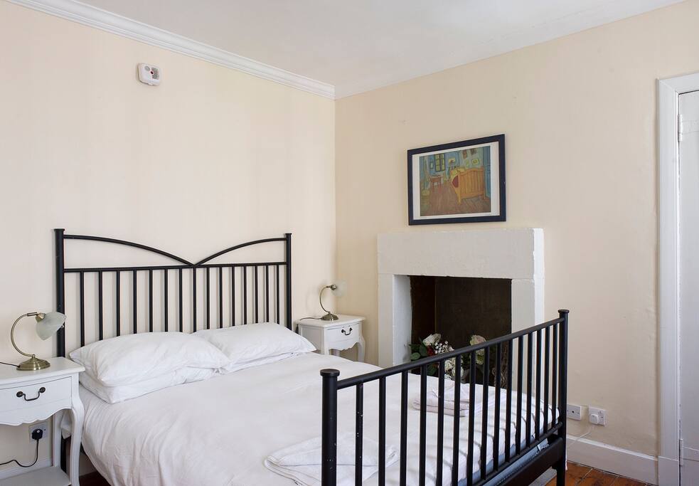 The comfy king size bed in the bedroom.