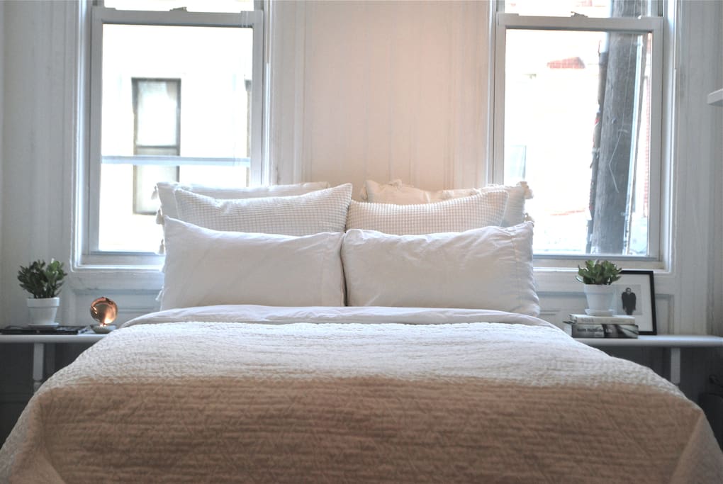 The master bedroom have a full size bed with comfortable pillows and a very cozy duvet.