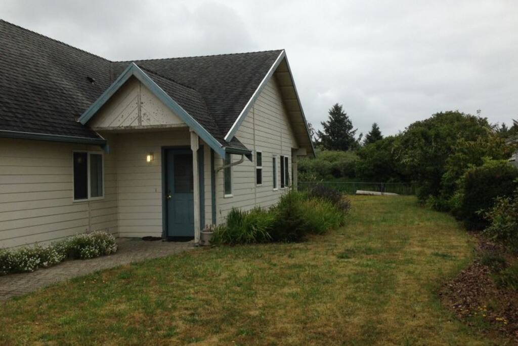 Front door and side yard to back