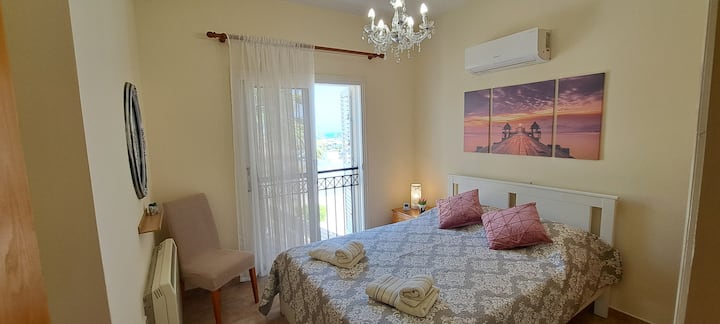 Bedroom 1 with double bed and sea view 