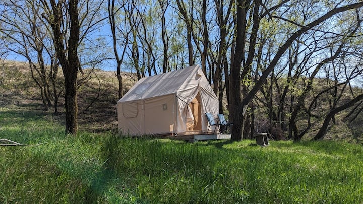 Our glamping cabin  offers a unique experience. 

A queen size bed and cozy feel. The small deck overlooks the main house.

**Use of the Safari tent requires an 8 person reservation.

Available from April 1 to October 31