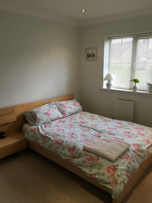 Bedroom 1 with double bed and wardrobe.