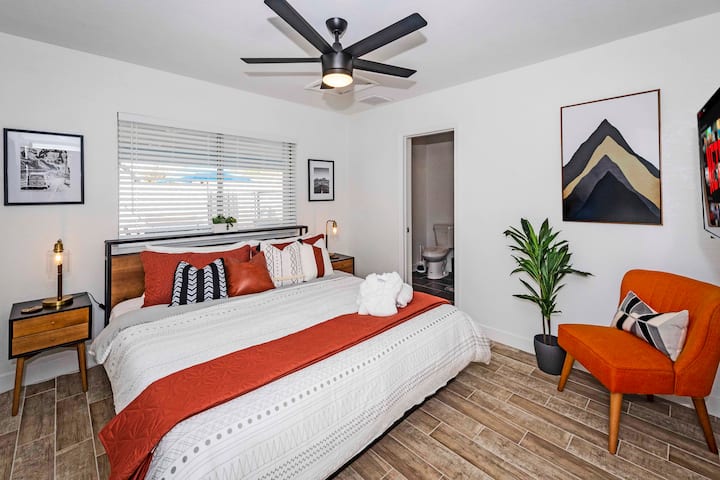 Second bedroom with king bed and 4K smart TV.