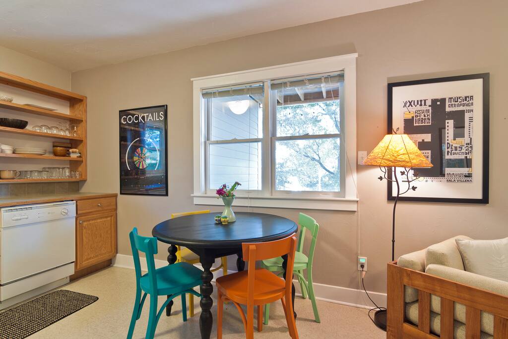 Dining area overlooking the quiet tree-lined backyard.