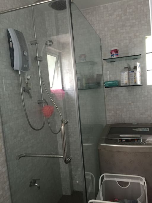 toilet inside master bedroom with heater & washer
