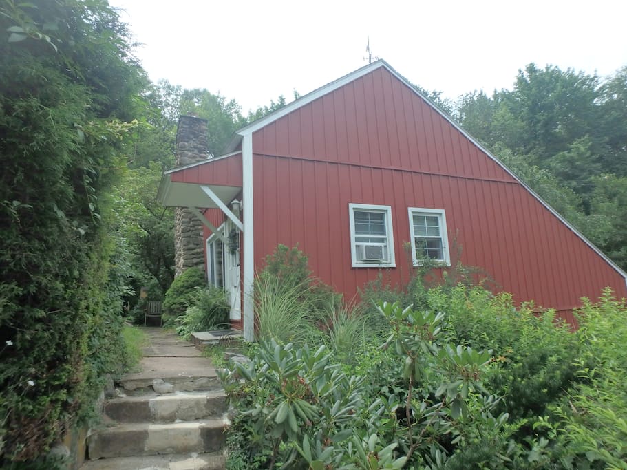 Entrance to apartment is up the steps next to garage