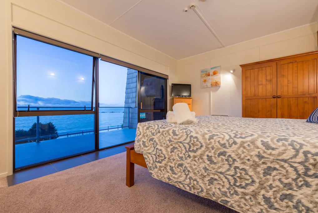 Main bedroom with King size bed. Overlooks Bay with private deck and retractable awning