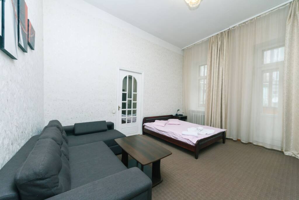 Living Room With Big Bed and Convertible Bed, AC and TV and Balcony