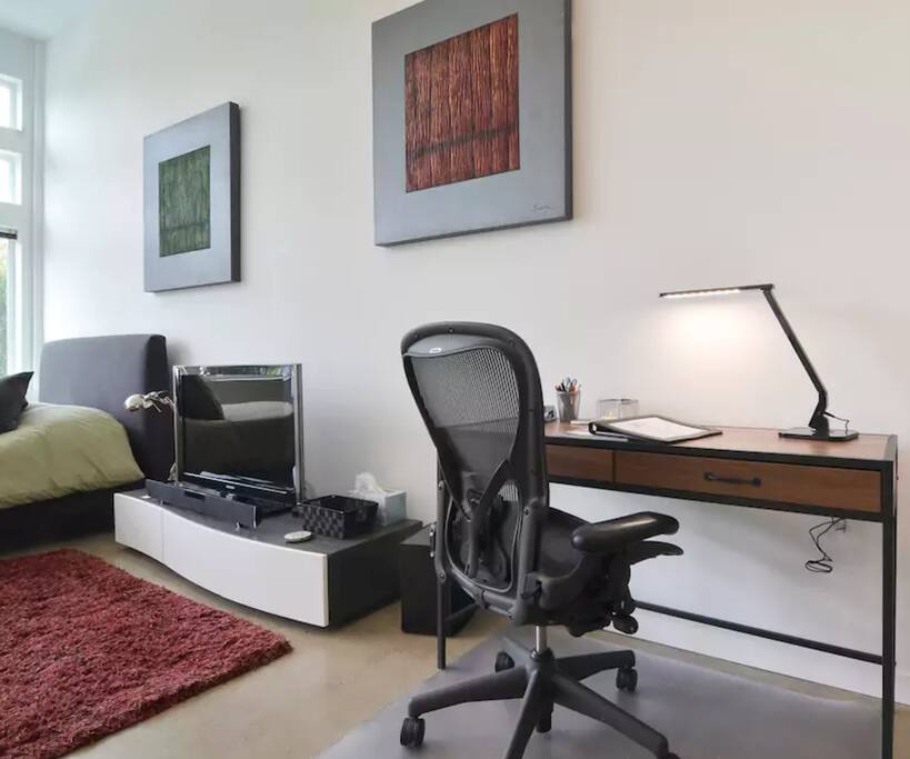 Work desk with Herman Miller Aeron chair.