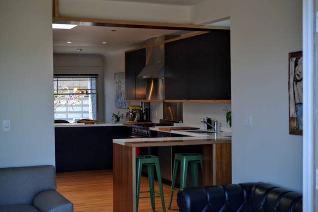 Open kitchen with bar-top seating.