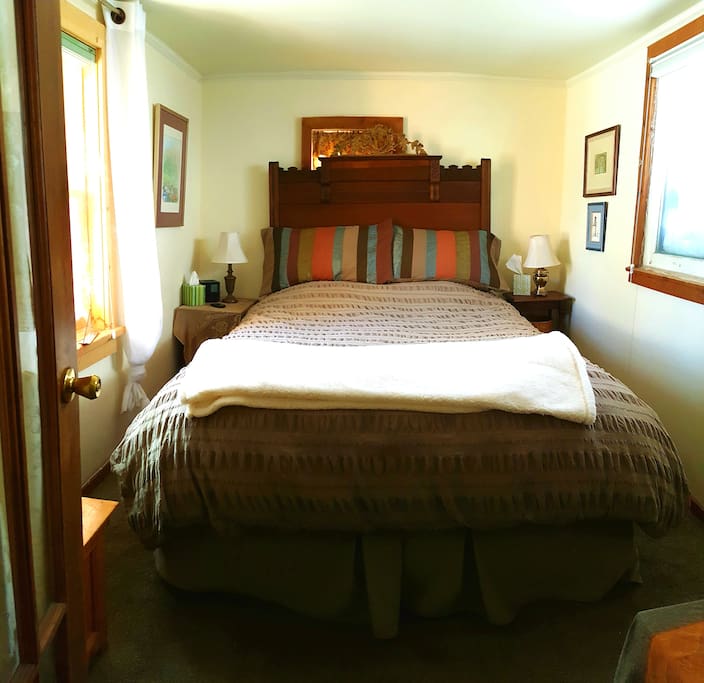 Your private room, queen sized bed and lots of light during the day, but dark at night.