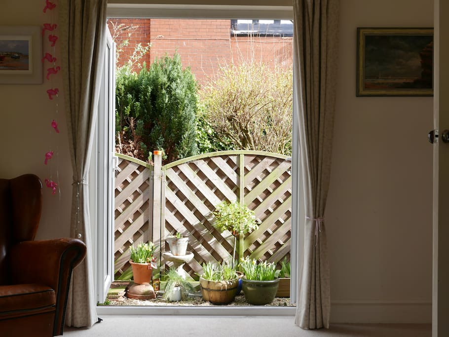 French windows from living room into small garden