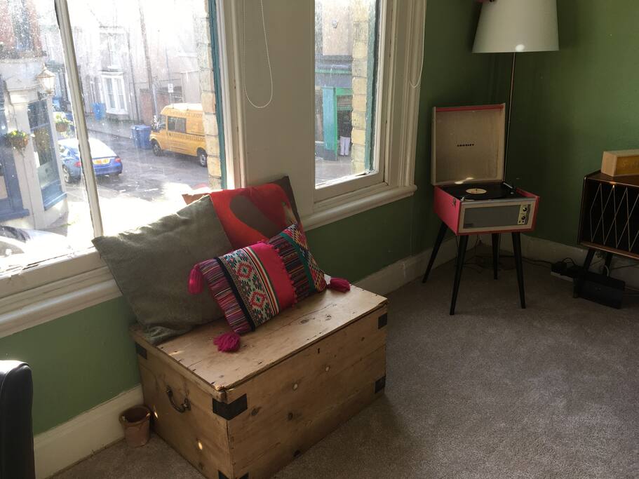 This is part of the spacious living room with giant windows and window seat, perfect for people watching with your morning coffee.