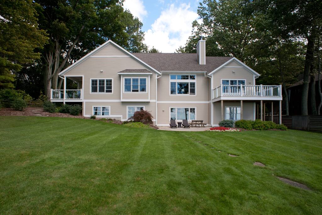 View of home from edge of blueff and top of stairs to Lake Michigan beach
