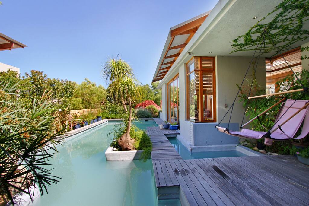 Pool shot with Balcony and deck Hammocks