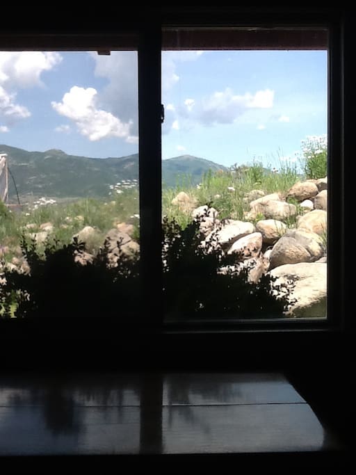 Peak to the right of center of window is top of Deer Valley Resort, Mayflower Bowl