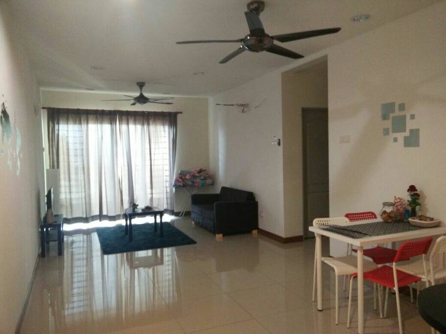Lounge Area with TV, Dining Space connecting to the Balcony