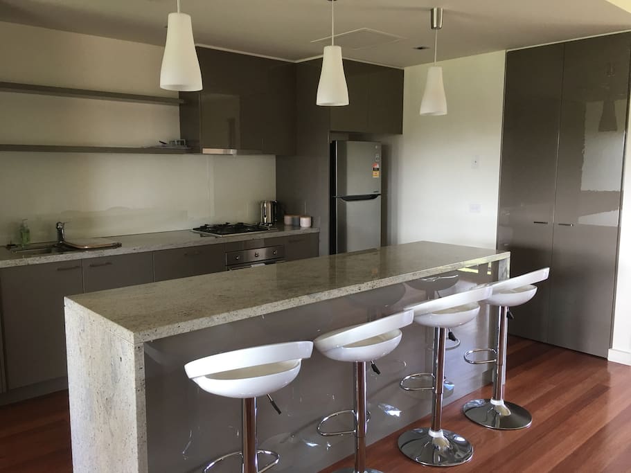 Open kitchen / living with island bench