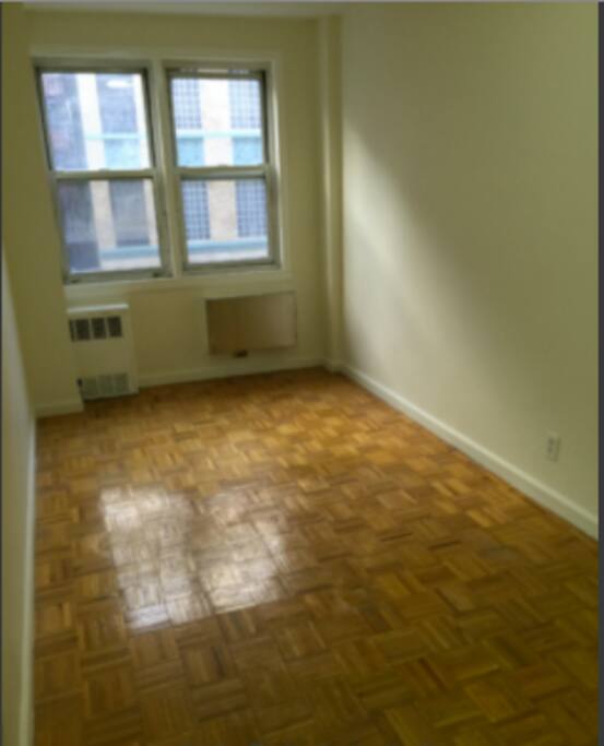 Private bedroom without furniture (only half of room shown)