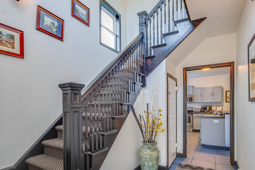 Entryway to first floor kitchen/rooms and stairway to second floor