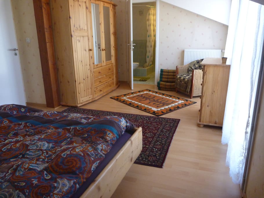 Bedroom with private bathroom and king-size waterbed