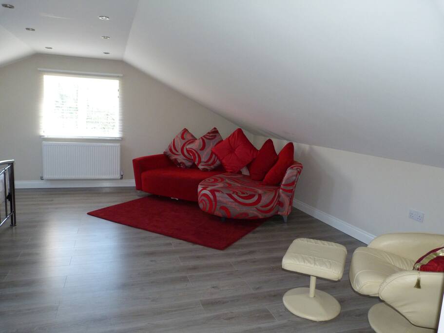 Sitting area overlooking garden and farmland