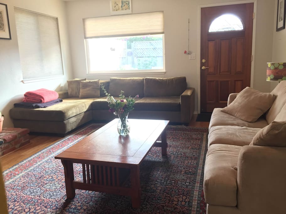Living room- complete with 2 couches (one couch bed), working fireplace, television and AppleTV.