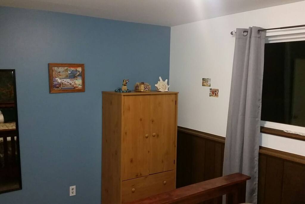 The "Hawaiian Room" with a pillow-top very comfortable queen bed and armoire for storing your clothes.