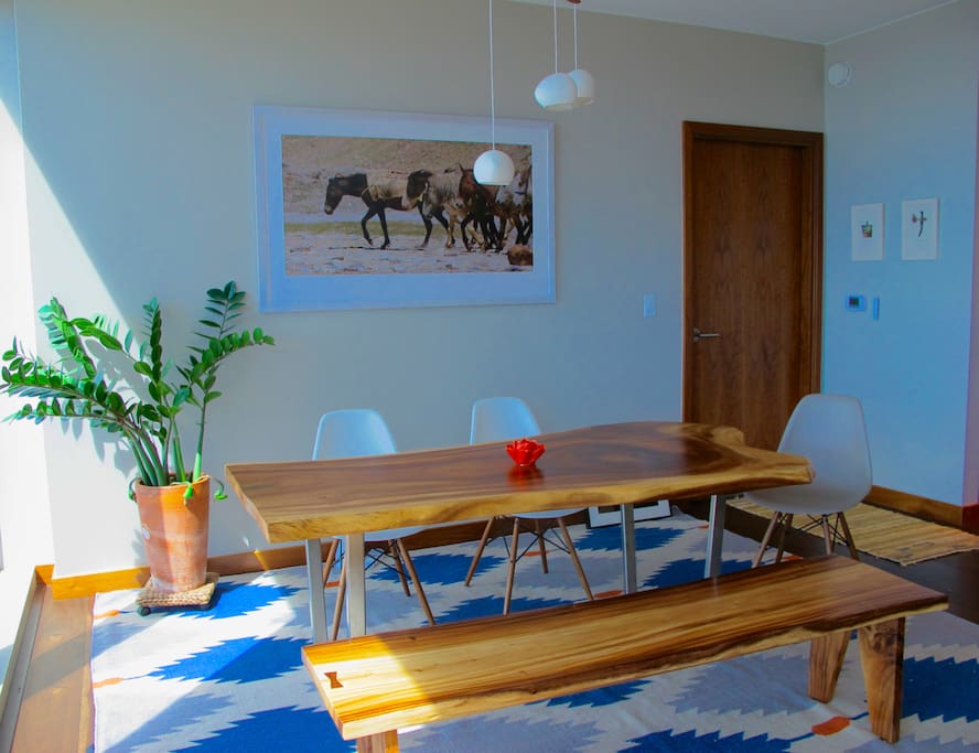 Monkey Pod hand made dining table with view of ocean facing south.